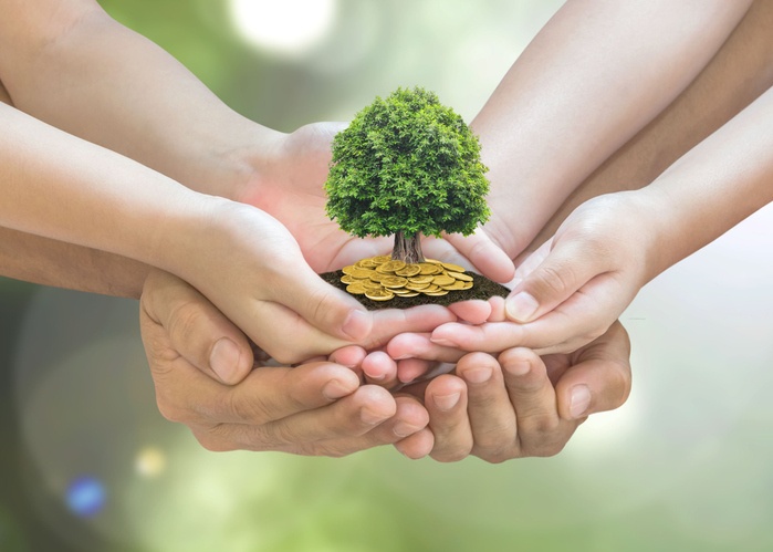 Retirement planning and family investment concept with wealthy tree growing on parent - children's hands